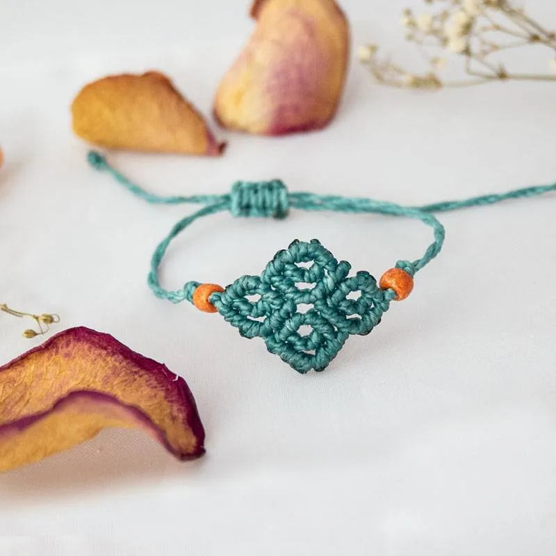 Bracciale Vortici Azzurro ghiaccio con perline arancio