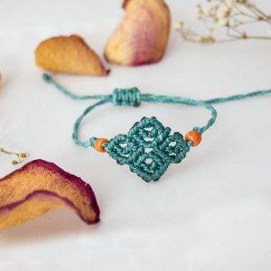 Bracciale Vortici Azzurro ghiaccio con perline arancio